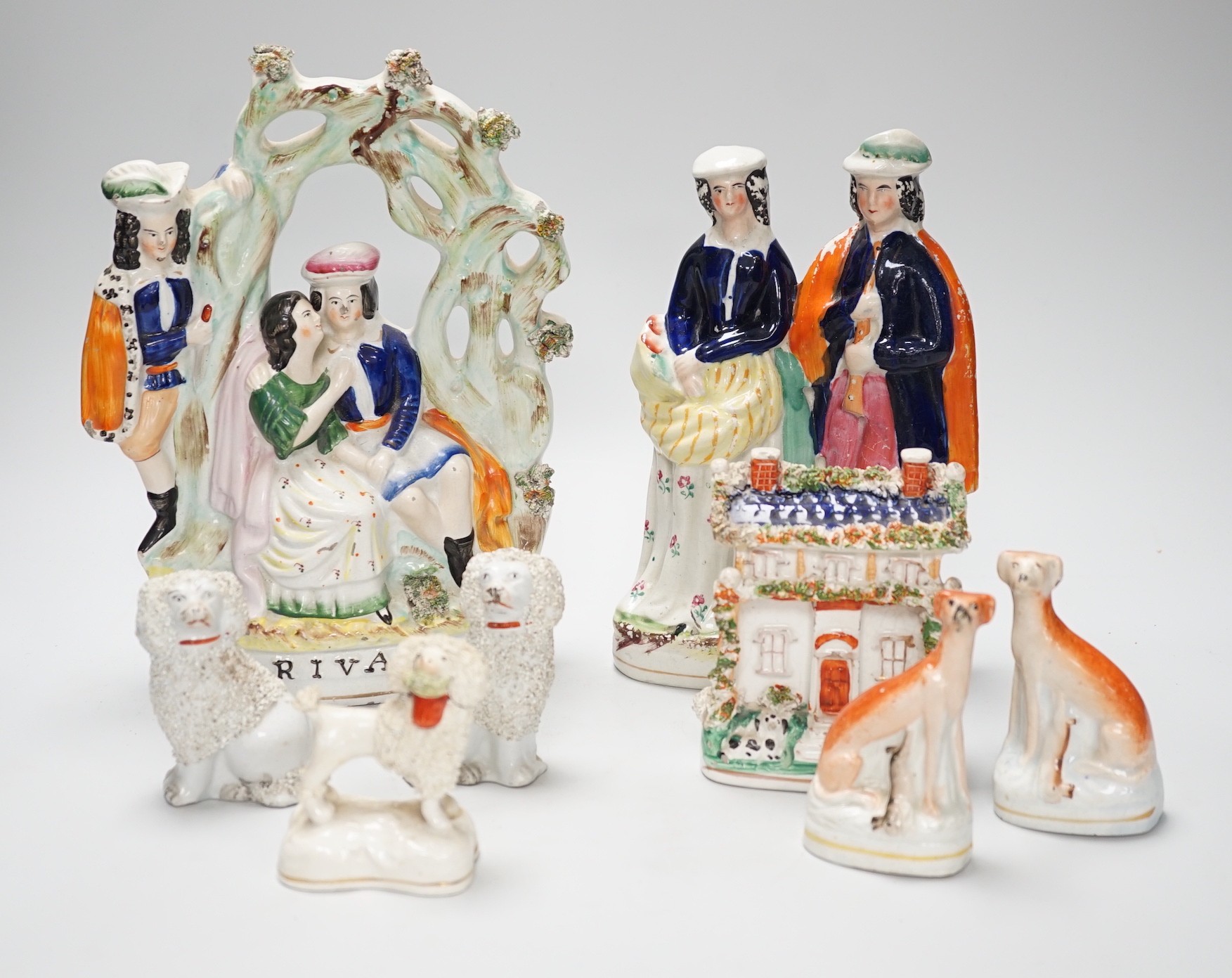 A selection of Staffordshire figure groups, greyhounds, spaniels, etc. tallest 26.5cm
